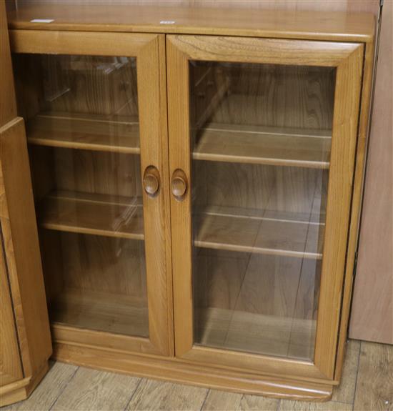 An Ercol bookcase, w.91cm